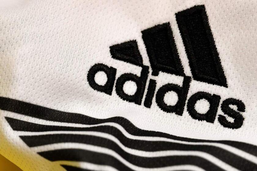 (FILES) This file photo taken on April 25, 2018 in Paris shows the logo of sports wear manufacturers Nike and Adidas for the FIFA 2018 World Cup football tournament. Although Russia World Cup teams will be as boldly emblazoned with logos as ever, sportswear makers see little hope this year of repeating sales leaps that greeted past tournaments in iconic football nations like Germany and Brazil. / AFP PHOTO / FRANCK FIFEFRANCK FIFE/AFP/Getty Images ** OUTS - ELSENT, FPG, CM - OUTS * NM, PH, VA if sourced by CT, LA or MoD **