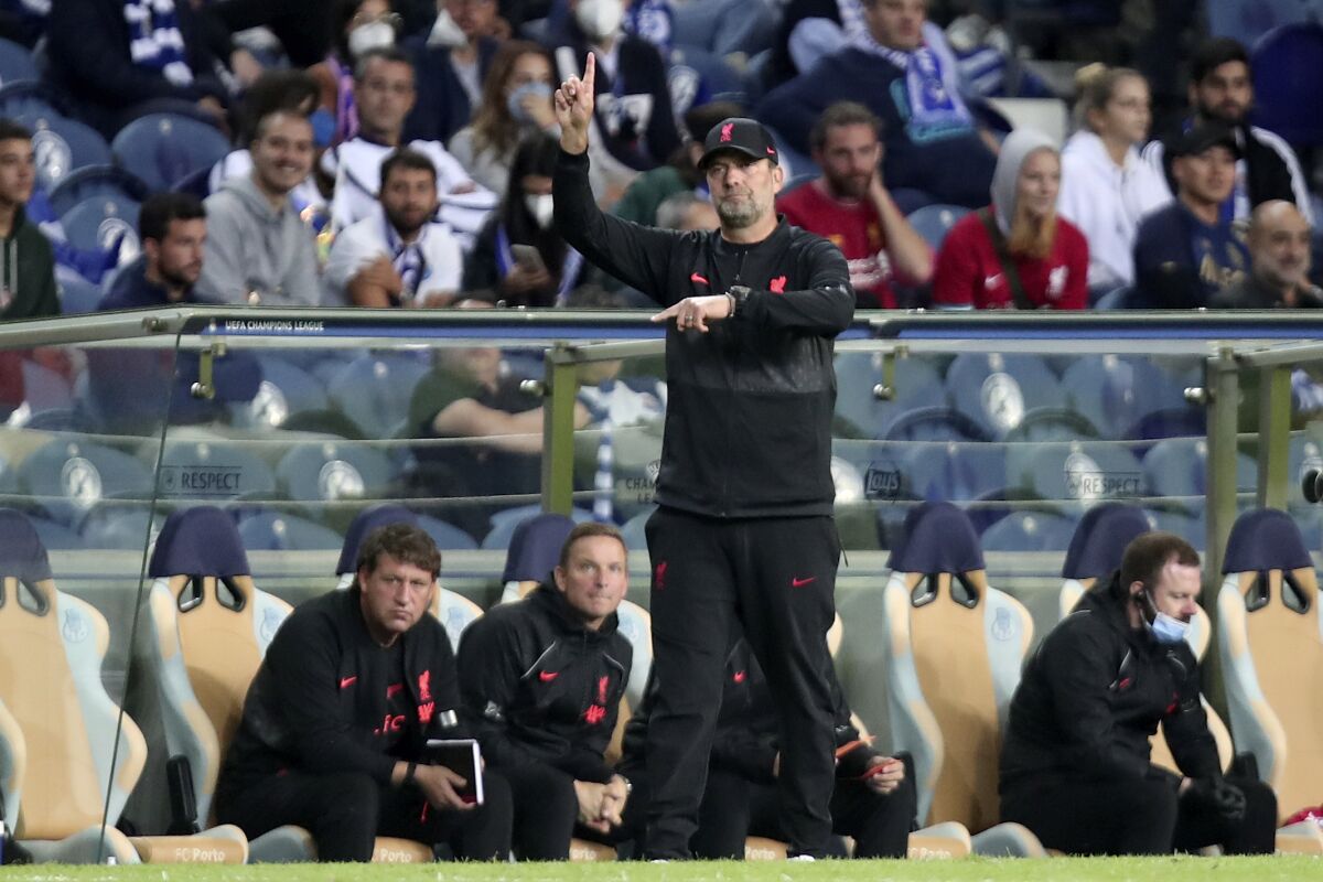 Liverpool's manager Jurgen Klopp gestures during the Champions League group B soccer match between FC Porto and Liverpool at the Dragao stadium in Porto, Portugal, Tuesday, Sept. 28, 2021. (AP Photo/Luis Vieira)