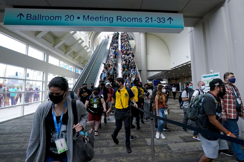 San Diego, CA - July 20: At San Diego Convention Center on Wednesday, July 20, 2022 in San Diego, CA., after waiting in line as early as 4am on Wednesday for entry into the exhibit hall, the ropes we’re removed allowing fans to enter Comic-Con 2022 exhibit hall. (Nelvin C. Cepeda / The San Diego Union-Tribune)