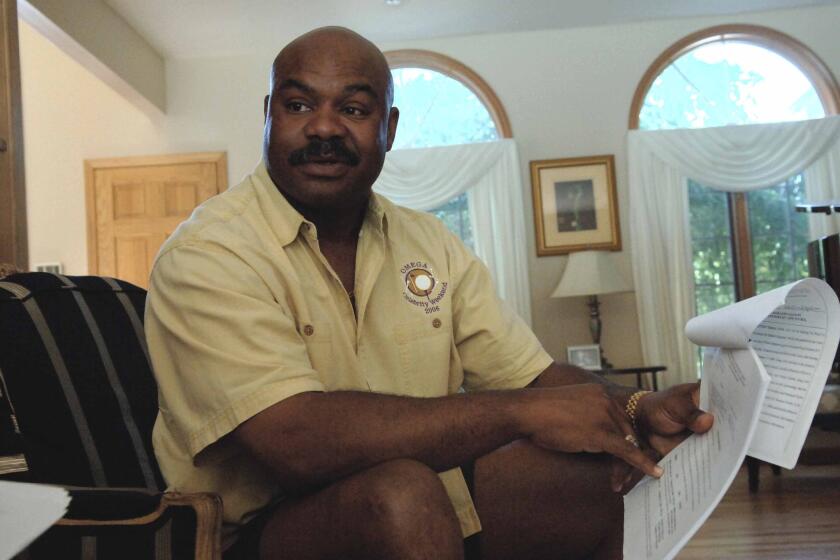 The late Dave Duerson in the living room of his Highland Park, Ill., home on June 18, 2007.