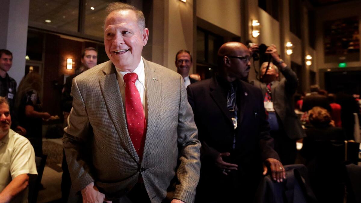 U.S. Senate candidate Roy Moore greets supporters before his election party in Montgomery, Ala. on Sept. 26.
