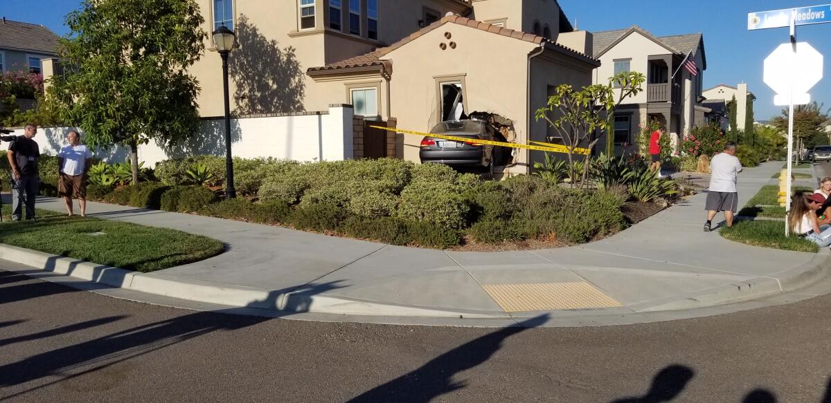 The car crashed into the home at the intersection of Lopelia Meadows Drive and Golden Lily Way.