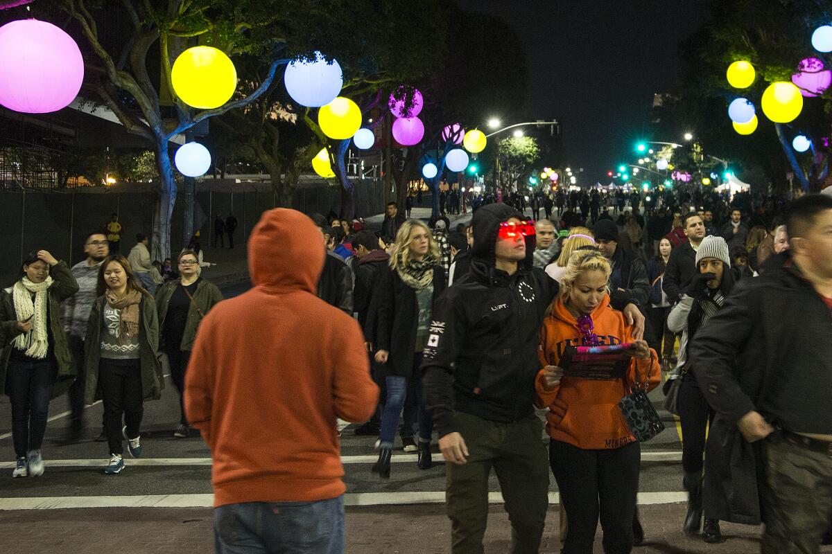 People arrive for the New Year's Eve celebration at Grand Park in Los Angeles in 2015.