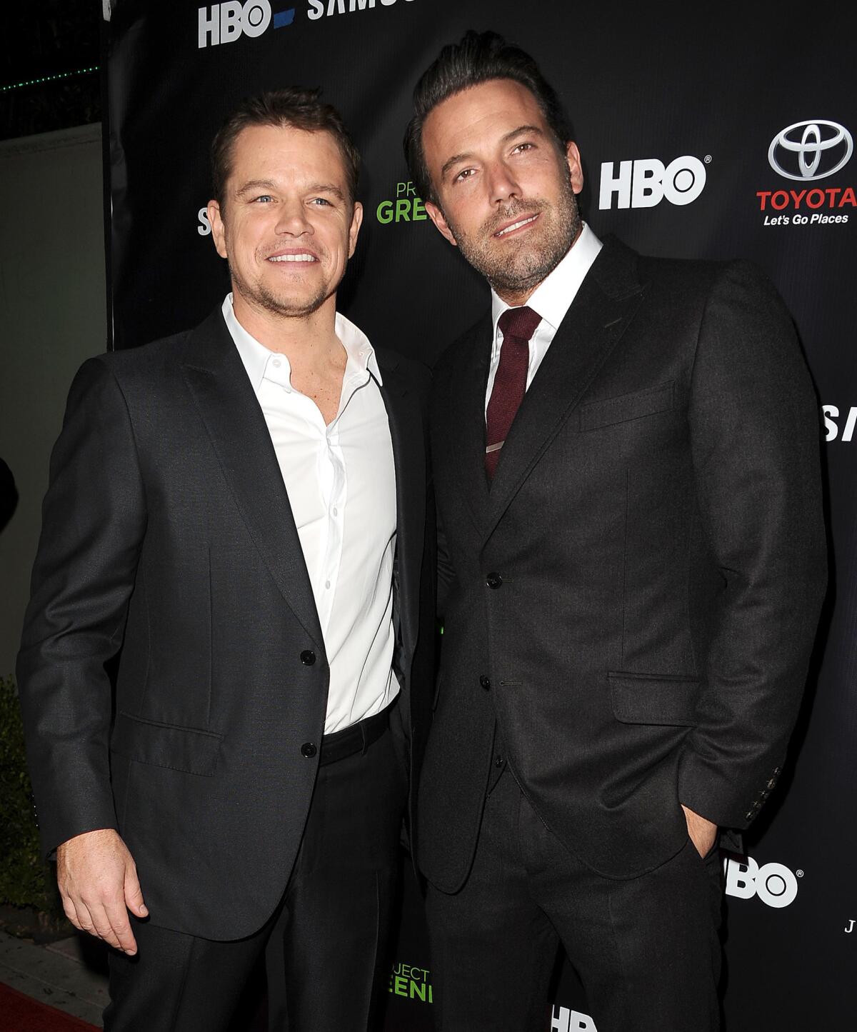 Matt Damon, left, and Ben Affleck will produce a film about the FIFA soccer organization scandal.
