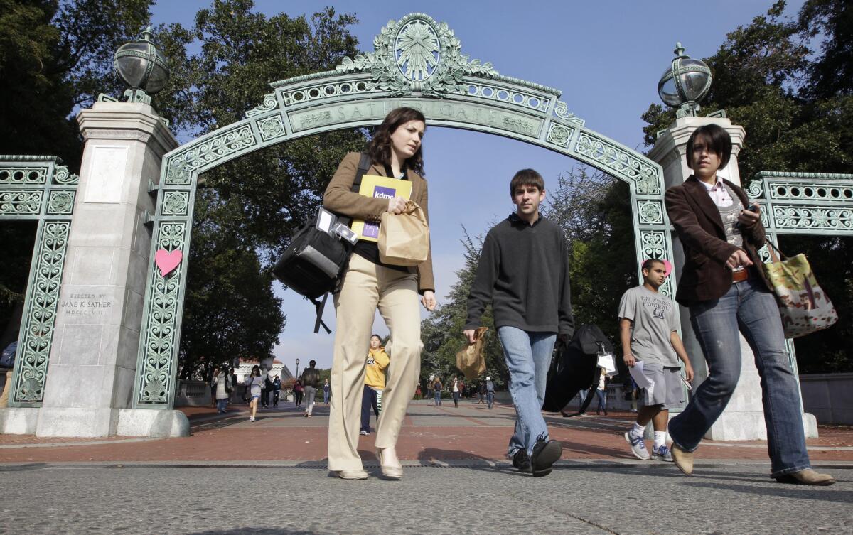 UC Berkeley students walk through Sather Gate.