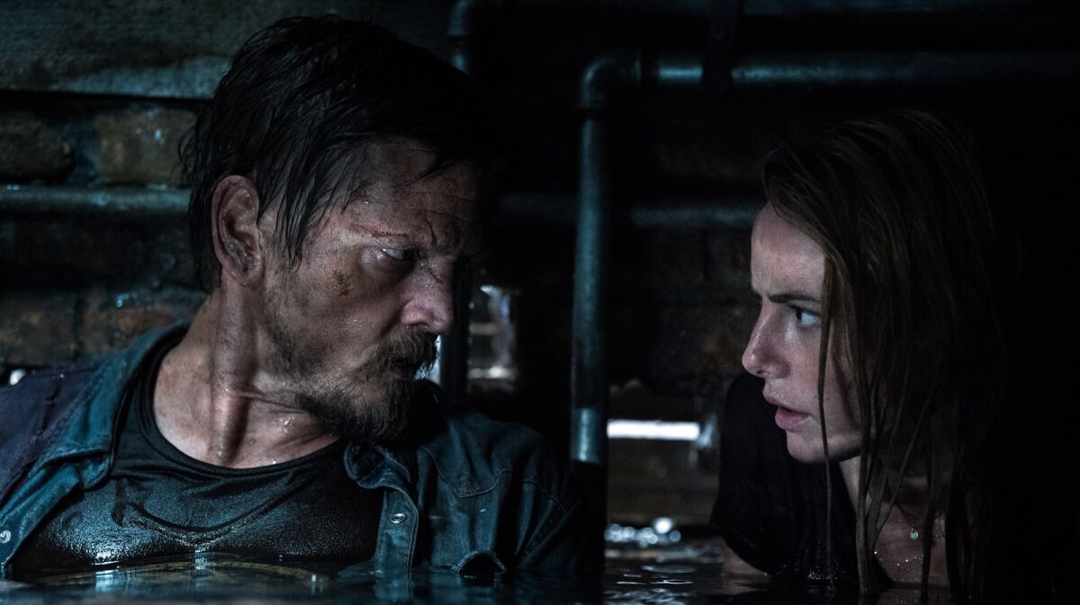 Barry Pepper and Kaya Scodelario in the movie "Crawl."