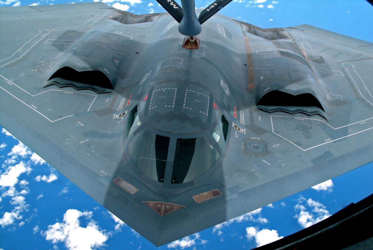 The partially repaired B-2, formally known as Spirit of Washington, is refueled on its way to Palmdale from Guam in August 2011. Workers in Guam repaired damage from a fire during takeoff. The heat from the blaze was so intense that it melted and warped parts of the B-2's frame.