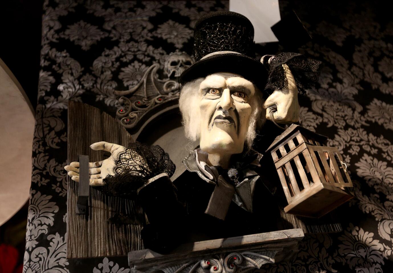 A wall decoration appears to offer a stern warning at Roger's Gardens' "Malice in Wonderland" Halloween boutique.