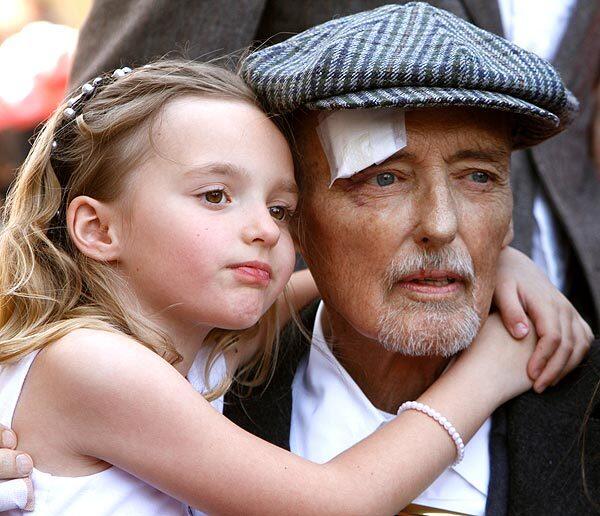 Actor Dennis Hopper hugs his 7-year-old daughter Galen on Friday morning as he receives the 2,403th star on Hollywood's Walk of Fame.