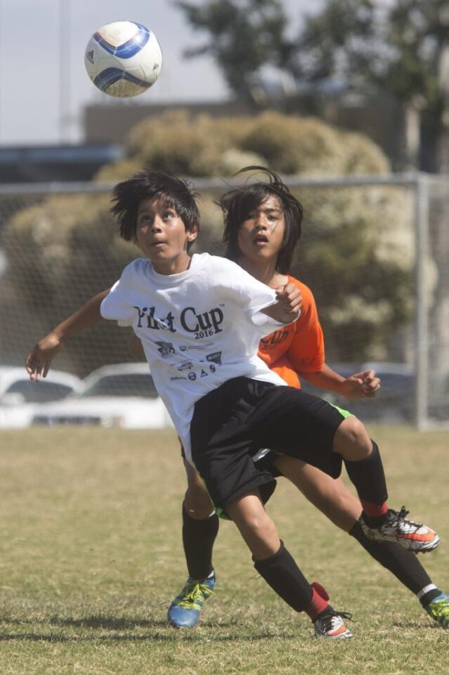 Whittier's Johan Guzman gains possession of the ball during the boys' 5-6 Gold Division championship game of the Daily Pilot Cup Sunday afternoon.