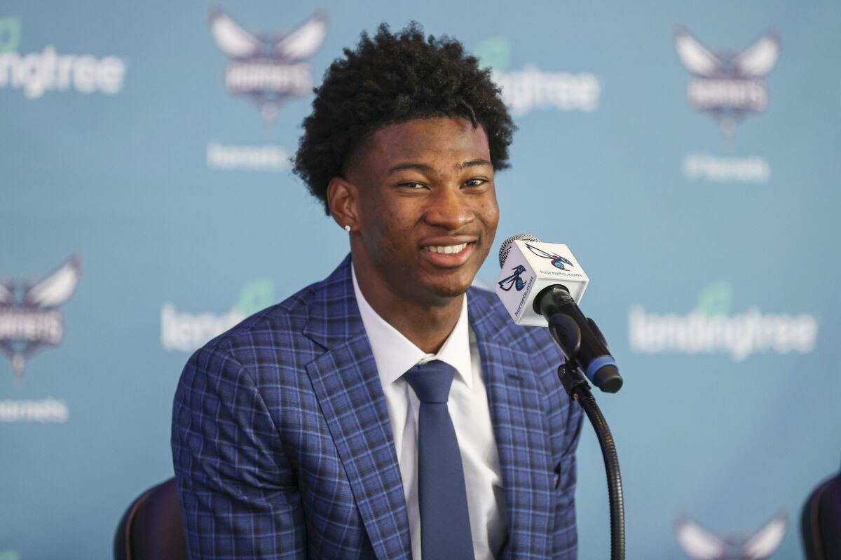 Charlotte Hornets 2021 NBA draft pick Kai Jones answers a question at a news conference in Charlotte, N.C., Friday, July 30, 2021. (AP Photo/Nell Redmond)
