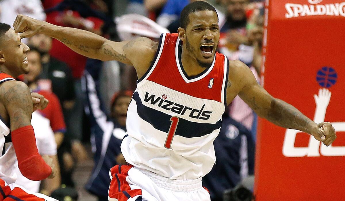 Wizards forward Trevor Ariza (1) celebrates after scoring against the Bulls late in the fourth quarter on Sunday in Washington.