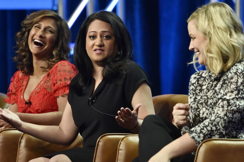 Aseem Batra, center, executive producer of the NBC Universal television series "I Feel Bad," takes part in a q&a session with cast member Sarayu Blue, left, and executive producer Amy Poehler during the 2018 Television Critics Association Summer Press Tour, Wednesday, Aug. 8, 2018, in Beverly Hills, Calif. (Photo by Chris Pizzello/Invision/AP)