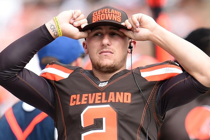 Cleveland's Johnny Manziel looks on from the sidelines against Oakland on Sunday.