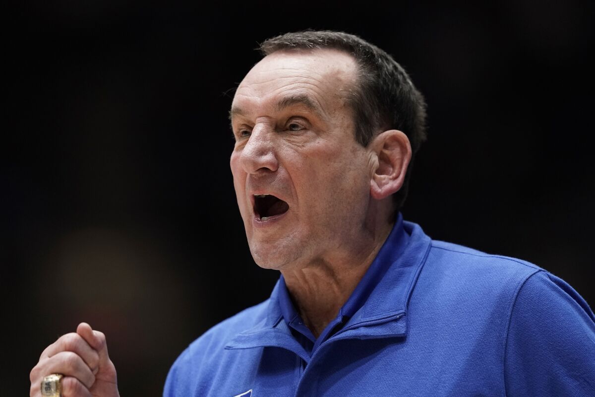 Duke coach Mike Krzyzewski directs the team during the second half of an NCAA college basketball game against Miami in Durham, N.C., Saturday, Jan. 8, 2022. (AP Photo/Gerry Broome)