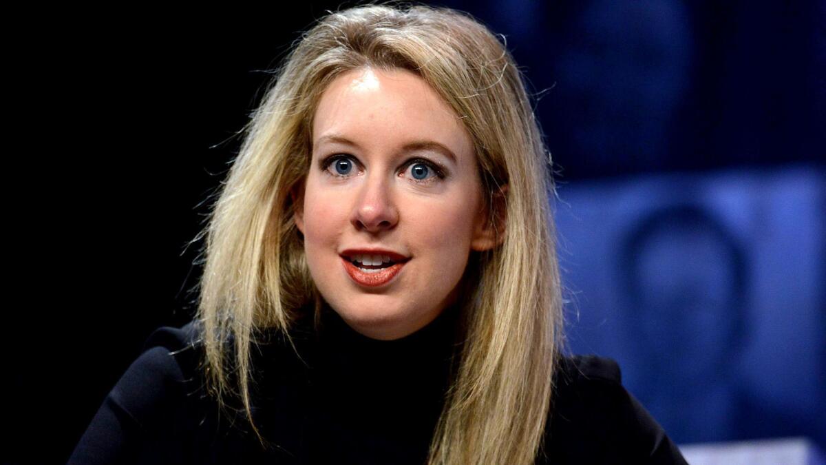 Elizabeth Holmes, founder and CEO of Theranos, speaks in 2015, the same year she was touted by Forbes as the youngest self-made female billionaire.