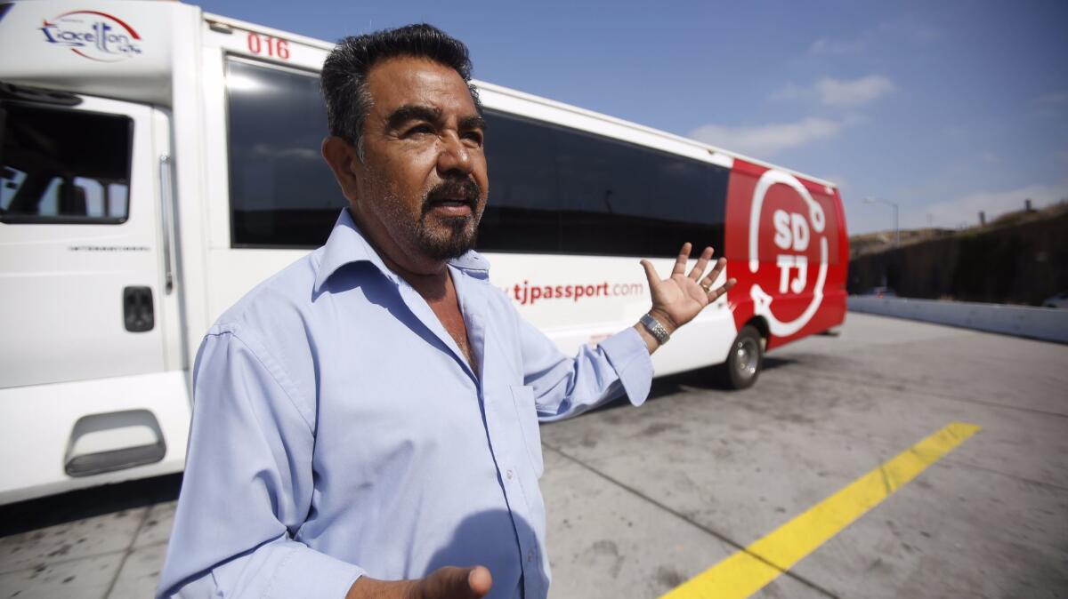 Carlos Díaz, president and founder of Ticketon, in San Ysidro with one of his new buses.