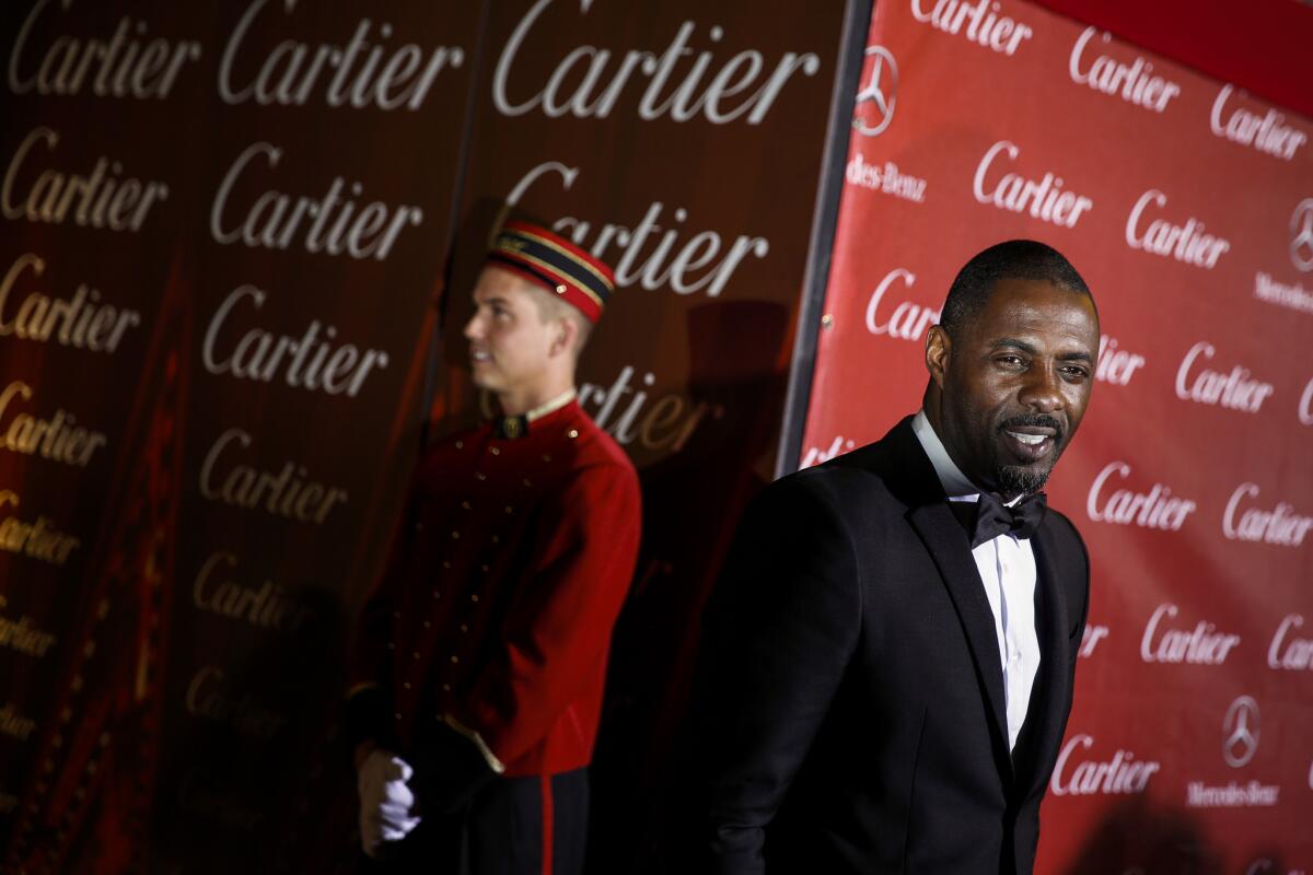 Idris Elba arriving at the 2014 Palm Springs International Film Festival awards gala. Elba is, according to the new James Bond scribe, "too street" to play Bond.