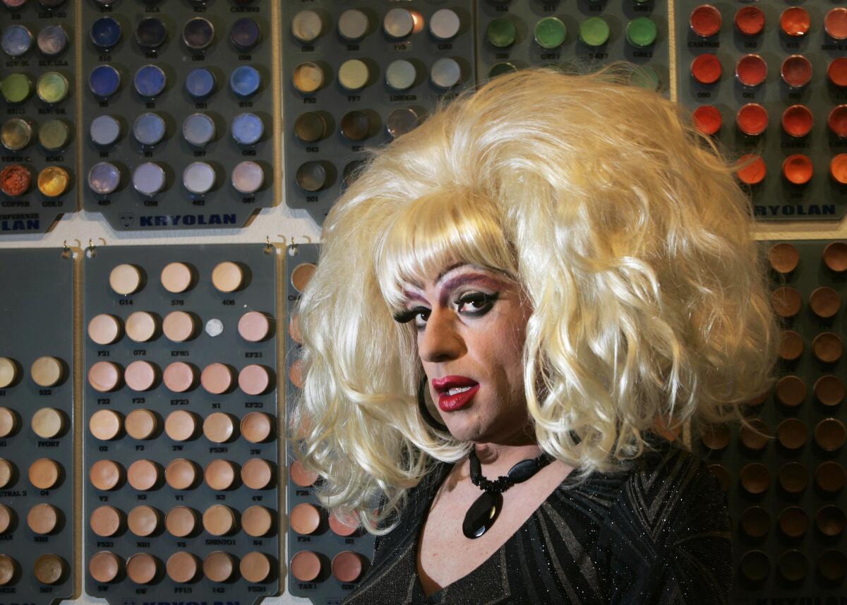 Drag queen Heklina in a head-and-shoulders frame, wearing a blonde wig, looking at camera.