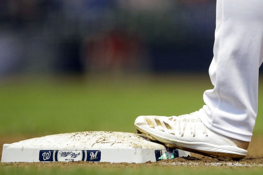 The cleats of Milwaukee Brewers' Ryan Braun are seen during the sixth inning of a baseball game against the Washington Nationals Wednesday, May 8, 2019, in Milwaukee. (AP Photo/Aaron Gash)
