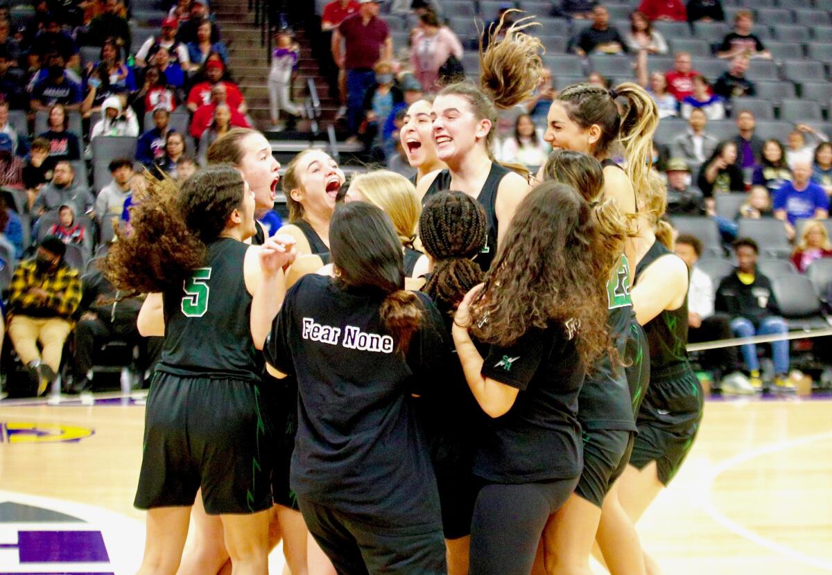 Sage Hill players celebrate winning the Division II state girls' basketball championship.