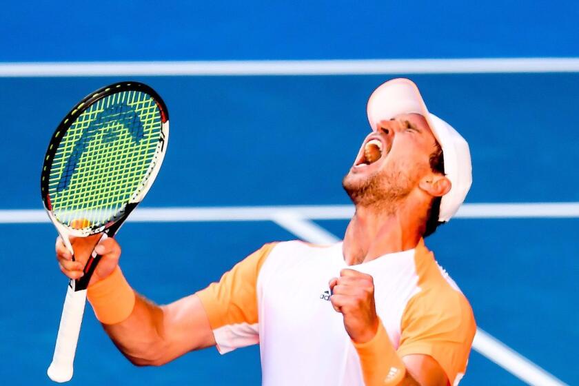 Mischa Zverev of Germany reacts en route to victory over Andy Murray of Britain at the Australian Open.