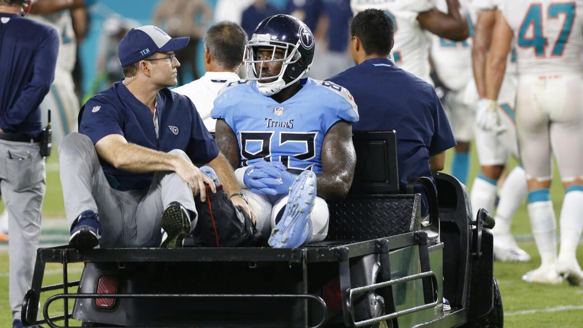 Tennessee Titans tight end Delanie Walker (82) is driven off the field after he injured his leg during the second half against the Miami Dolphins.