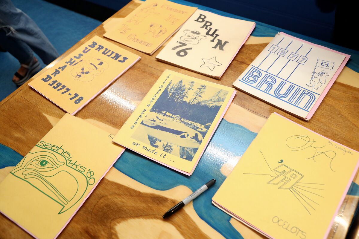 Yearbooks from 1975 to 1980 are laid out during Bushard Elementary School's all-class reunion at Zubie's Dry Dock.