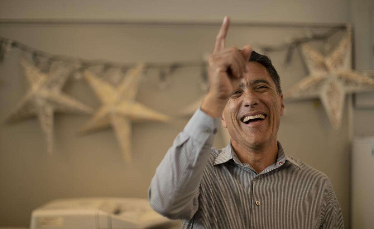 Hector Murrieta, the principal at Sierra High School in San Bernardino, smiles in an office. 