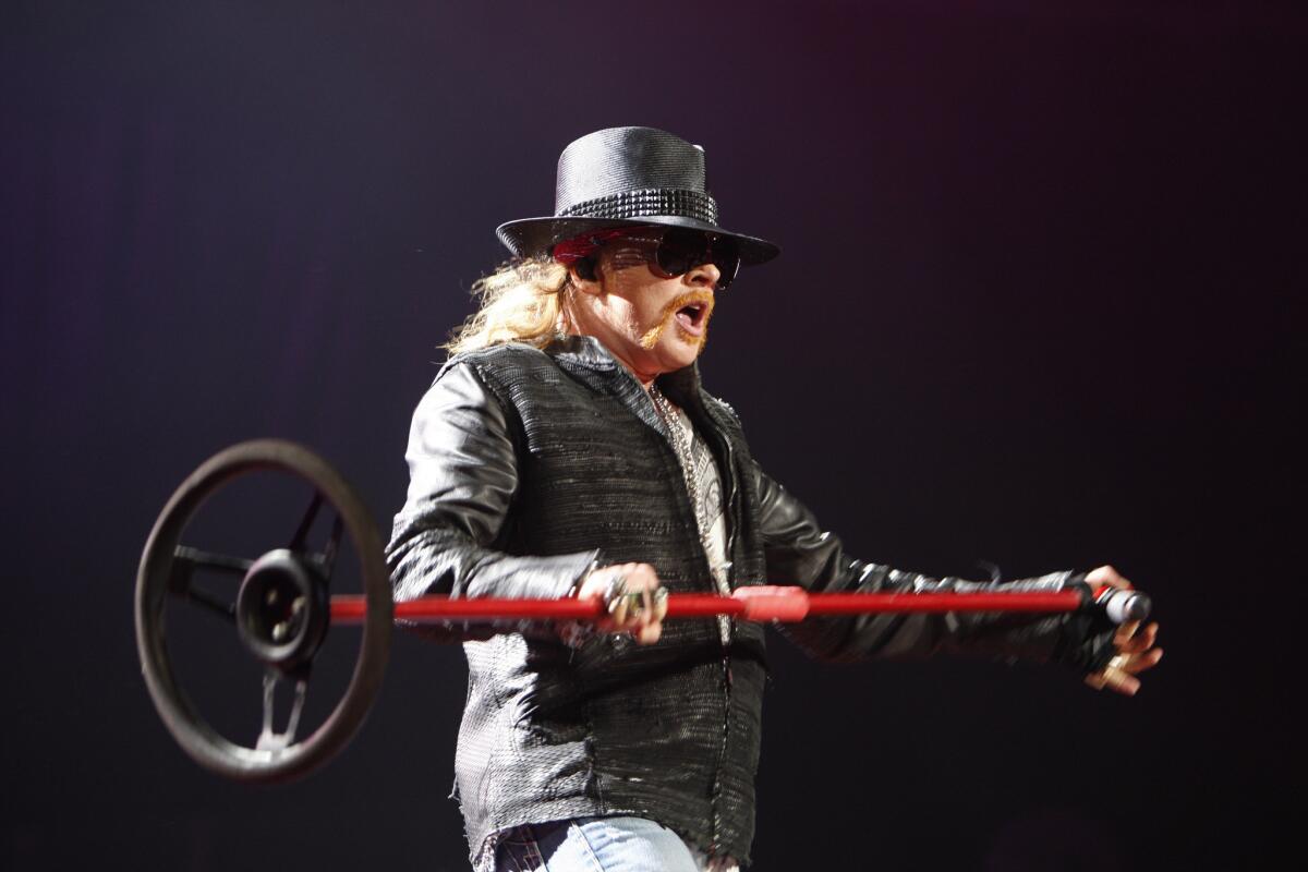 Guns N' Roses lead singer Axl Rose performs in Seattle in 2011. His band will headline Coachella in April, but you won't hear about it on "Jimmy Kimmel Live" on Tuesday. He's no longer scheduled to appear.