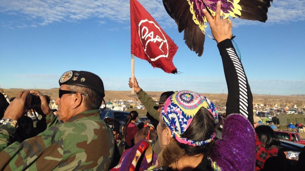 Demonstrators against the Dakota Access oil pipeline hold a ceremony at the main protest camp Nov. 15 near Cannon Ball, North Dakota.