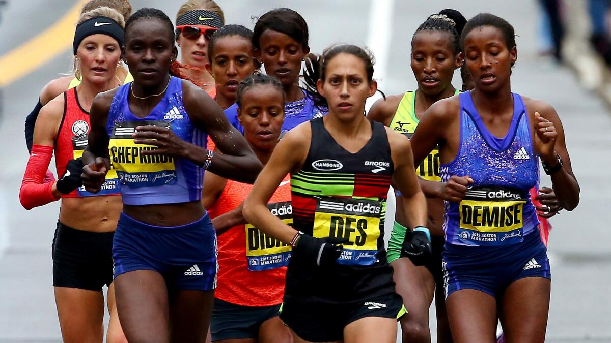 Desiree Linden, front and center, leads the elite women during the Boston Marathon last April.