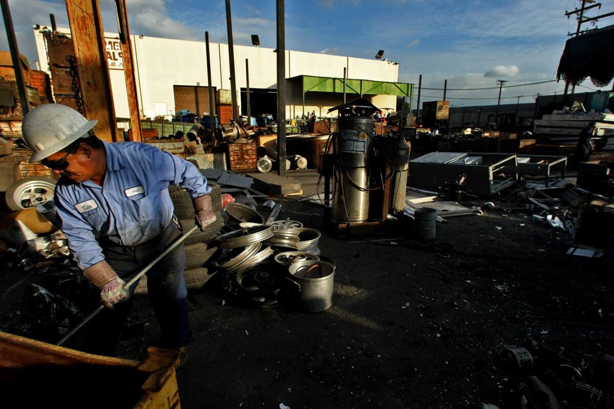 A Kramer Metals employee works at the South L.A. facility. Concerned over what it called excessive levels of copper, zinc and lead running off Kramer's property, L.A. Waterkeeper eventually sued to force the company to either treat the water it was releasing or eliminate its discharges.