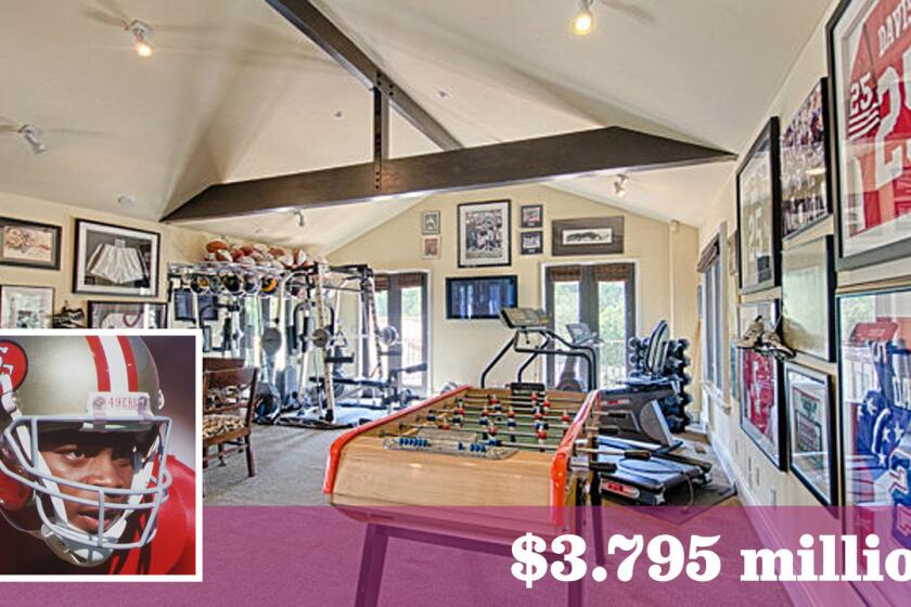 Football jerseys and memorabilia are displayed prominently in the home of former San Francisco cornerback Eric Davis, who asks $3.795 million for his Santa Cruz-area home.