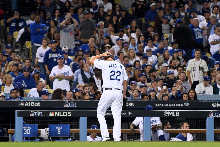 LOS ANGELES, CALIFORNIA OCTOBER 9, 2019-Ddogers Clayton Kershaw walks back to the dugout after giving up two solo home runs to the Nationals in the 8th inning in Game 5 of the NLDS at Dodger Stadium Wednesday. (Wally Skalij/Los Angeles Times)