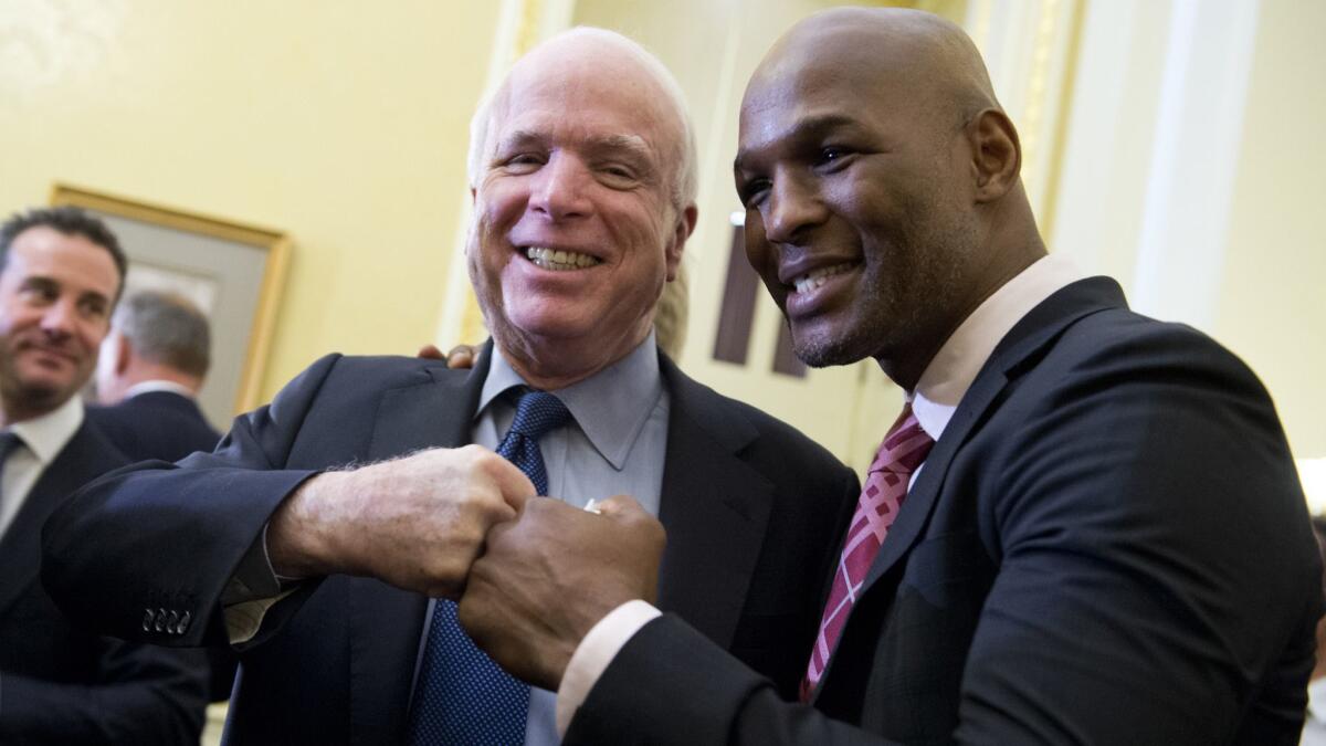 Sen. John McCain poses with boxer Bernard Hopkins.