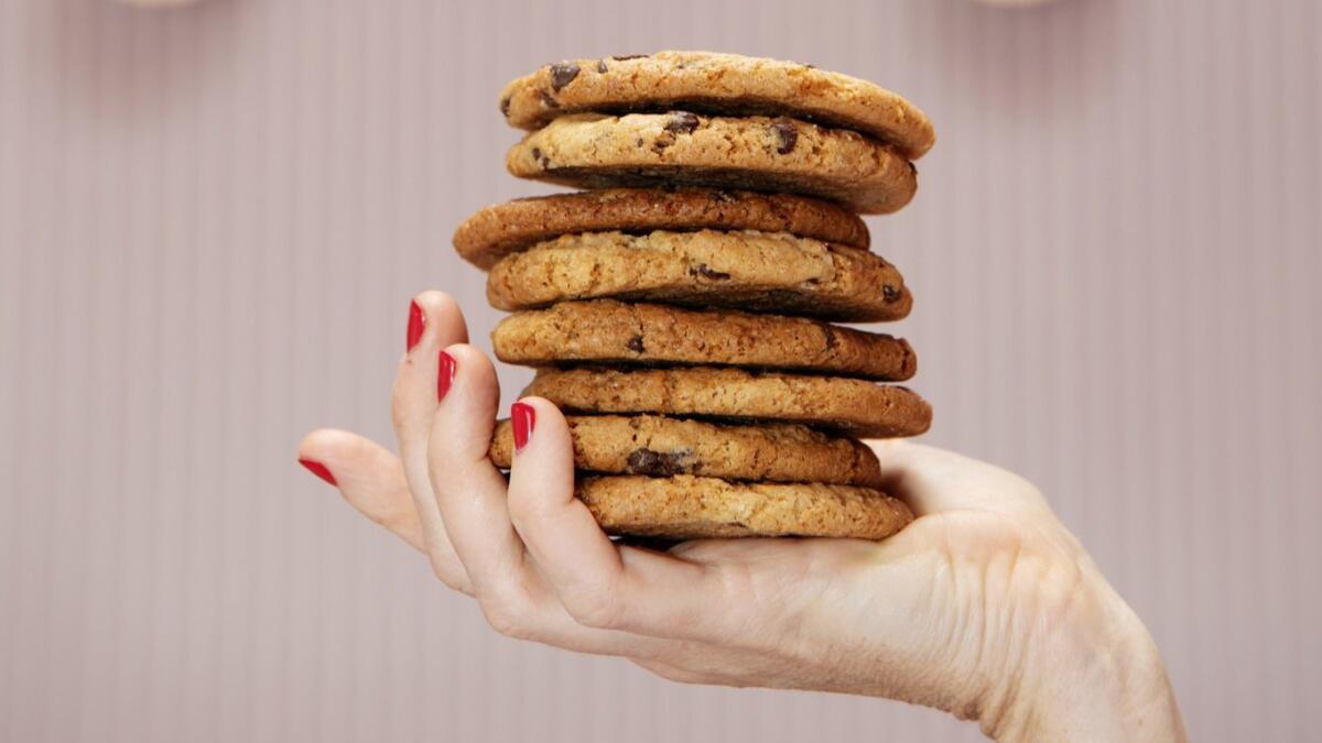 Erin McKenna displays a stack of her bestselling chocolate chip cookies in her bakery. You can bake them at home too.