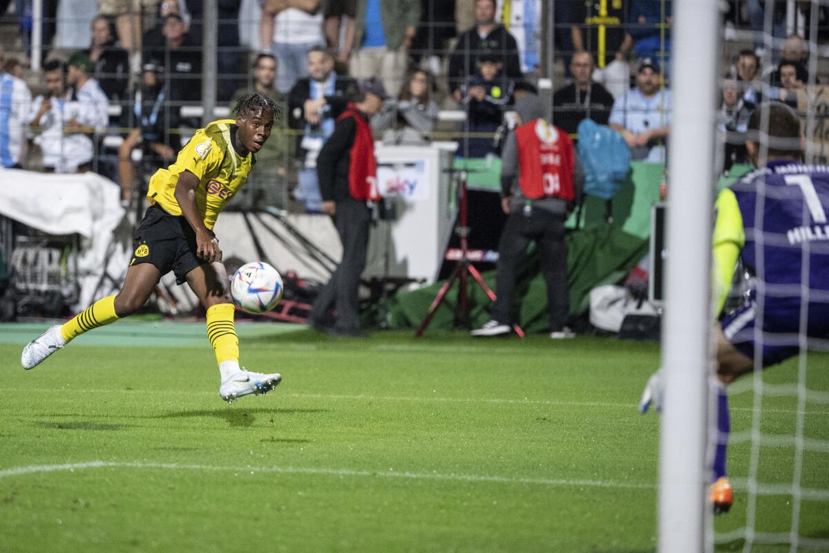 FILE - Jamie Bynoe-Gittens from Borussia Dortmund controls the ball, during the German Soccer Cup 1st round match betwen 1860 Munich and Borussia Dortmund, in Munich, Germany, Friday, July 29, 2022. Dortmund announced Tuesday, Aug. 16, 2022, that it was extending the 18-year-old Bynoe-Gittens’ contract ahead of time to June 2025, warding off any potential suitors who may have noticed his impact already this season. (Matthias Balk/dpa via AP, File)