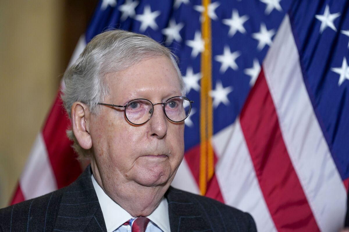 Senate Minority Leader Mitch McConnell of Ky., arrives to speak to reporters on Capitol Hill in Washington, Tuesday, Feb. 8, 2022. Senate Republicans blame the Republican National Committee. The Republican National Committee blames two Republican House members. They blame former President Donald Trump. And Trump blames McConnell. In the midst of the GOP’s first major election year blowup, each group believes it represents the real Republican Party and its best interests in 2022. (AP Photo/Susan Walsh)