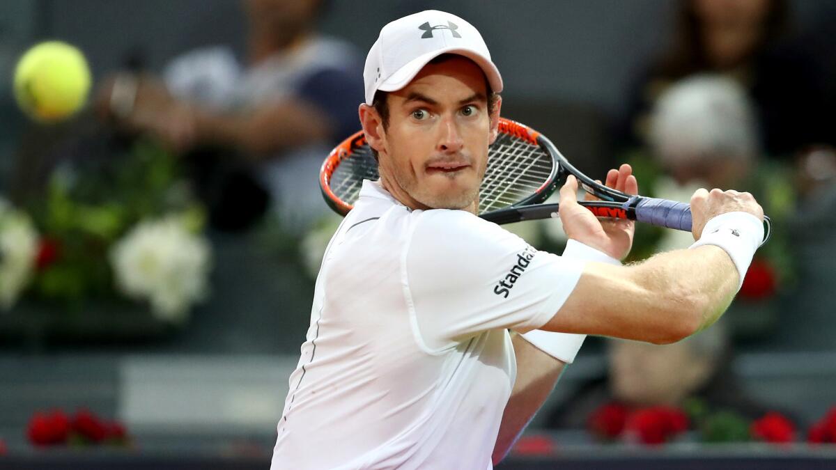 Andy Murray prepares to hit a backhand against Borna Coric during their third-round match at the Madrid Open on Thursday.
