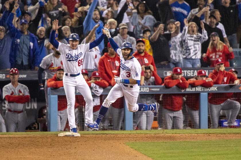 LOS ANGELES, CA - OCTOBER 6, 2021: Los Angeles Dodgers left fielder Chris Taylor (3) reacts while running the bases after his 2-run homer wins the game against the St Louis Cardinals in the National League Wild Card game at Dodger Stadium on October 6, 2021 in Los Angeles, California.(Gina Ferazzi / Los Angeles Times)