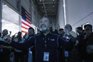 Main Engine Control Computer designer for Intuitive Machines Dan Harrison cheers amongst fellow employees during a watch party moments after they became the first commercial company to softly land on the moon on Thursday, Feb. 22, 2024, in Houston. ( Raquel Natalicchio/Houston Chronicle via AP)