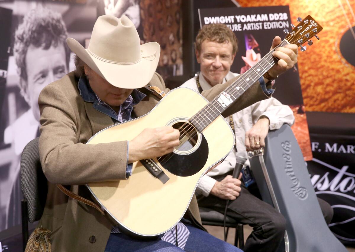 Singer-songwriter Dwight Yoakam, left, and Martin & Co. CEO Chris Martin IV at the 2017 NAMM Show opening day at Anaheim Convention Center on Thursday in Anaheim.