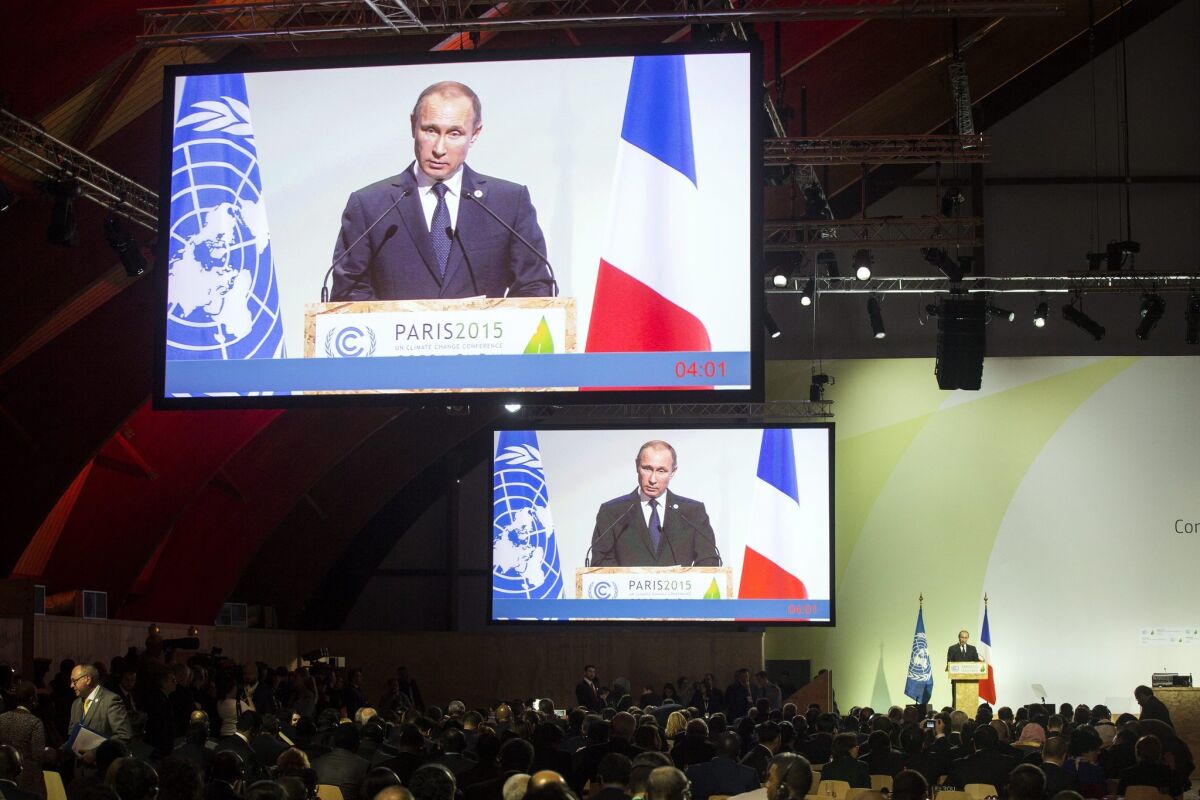 Russian President Vladimir Putin delivers a speech as he attends Heads of States' Statements ceremony of the COP21 World Climate Change Conference 2015 north of Paris.