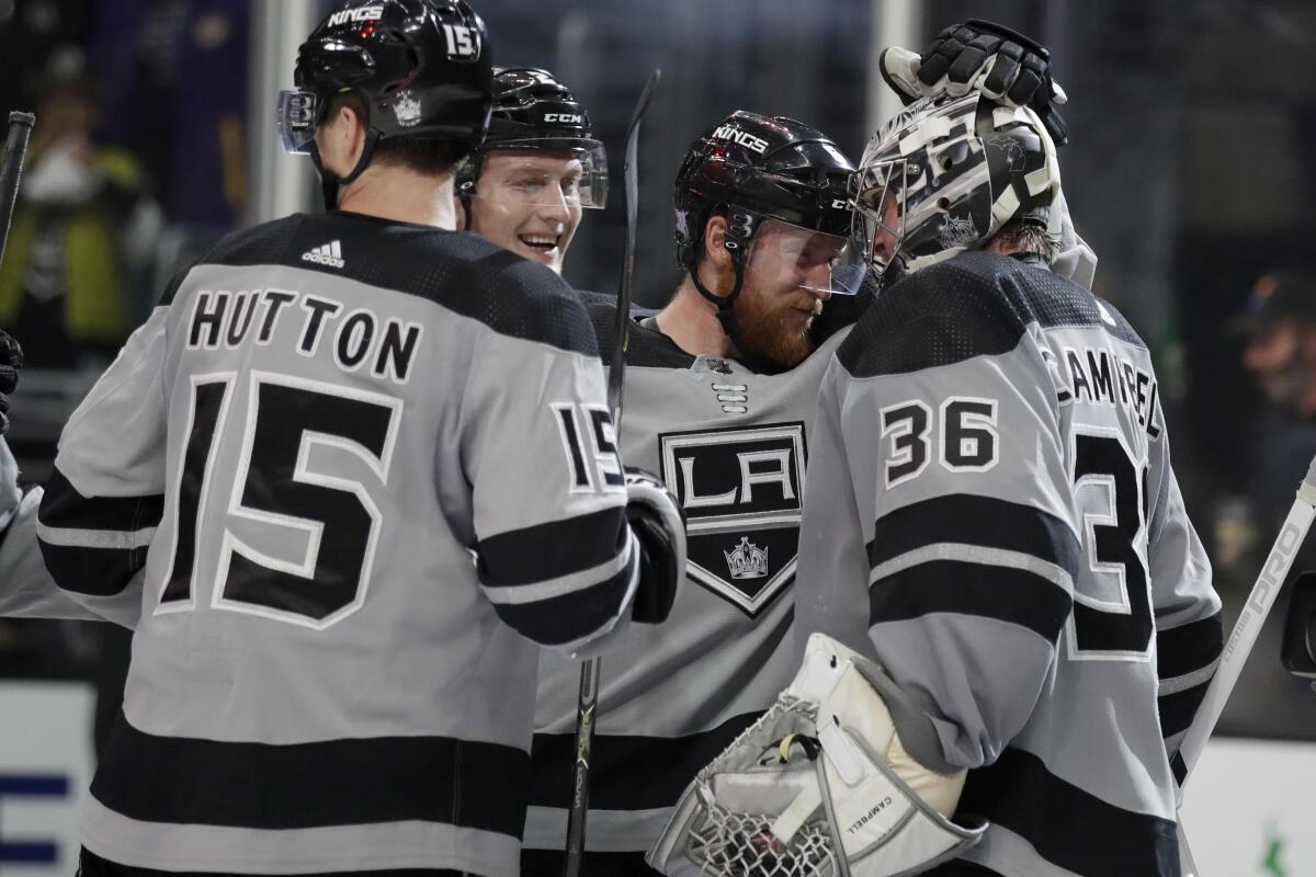 The Kings celebrate a 2-1 win over the Winnipeg Jets on Saturday at Staples Center.