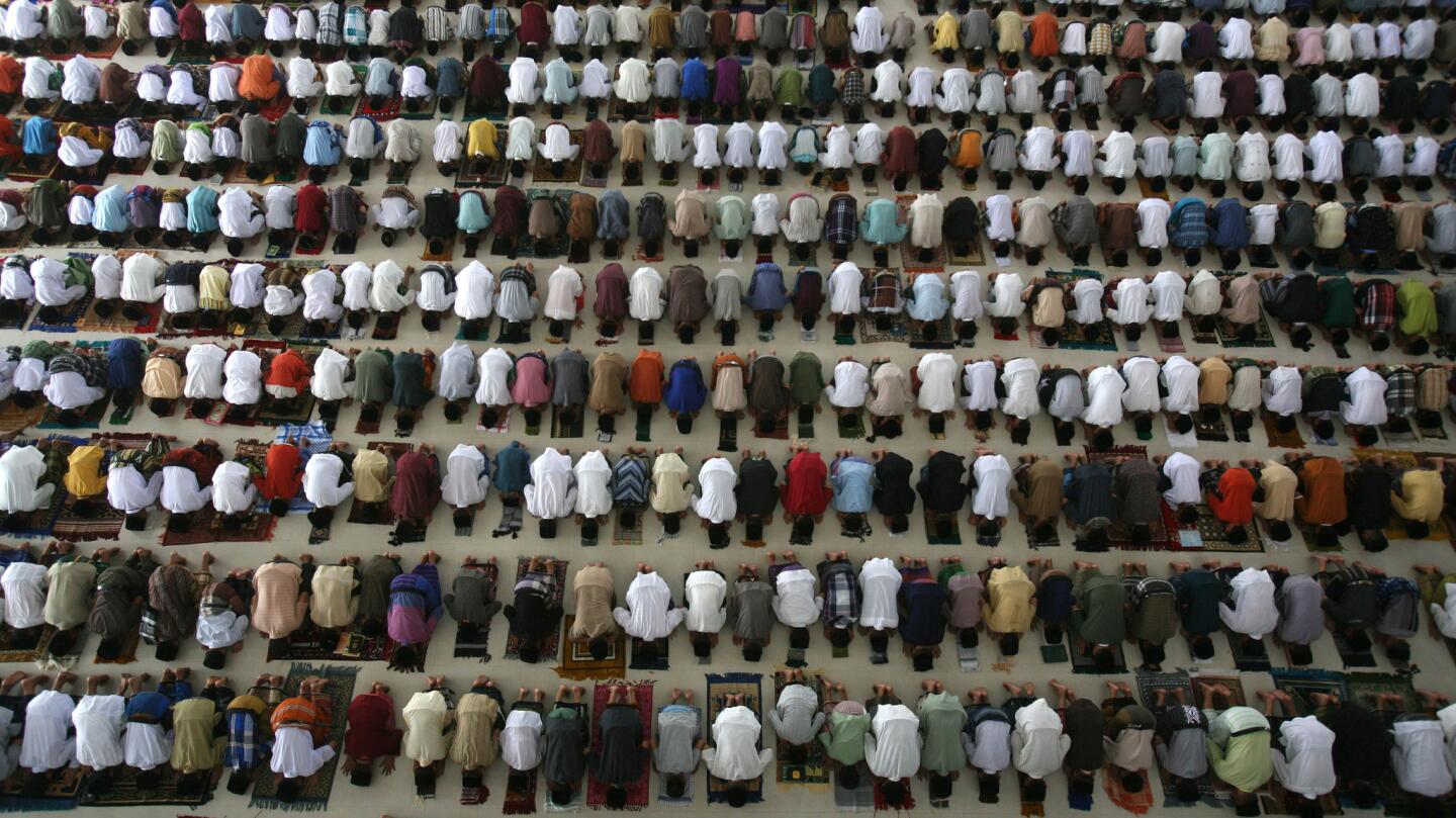 Students at an Islamic boarding school pray on the first day of Ramadan in Medan, in Indonesia's North Sumatra province.