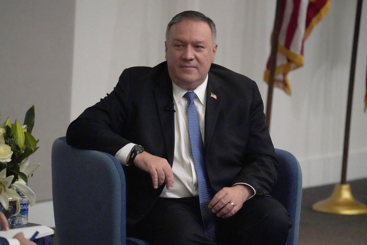 Secretary of State Michael R. Pompeo seated.