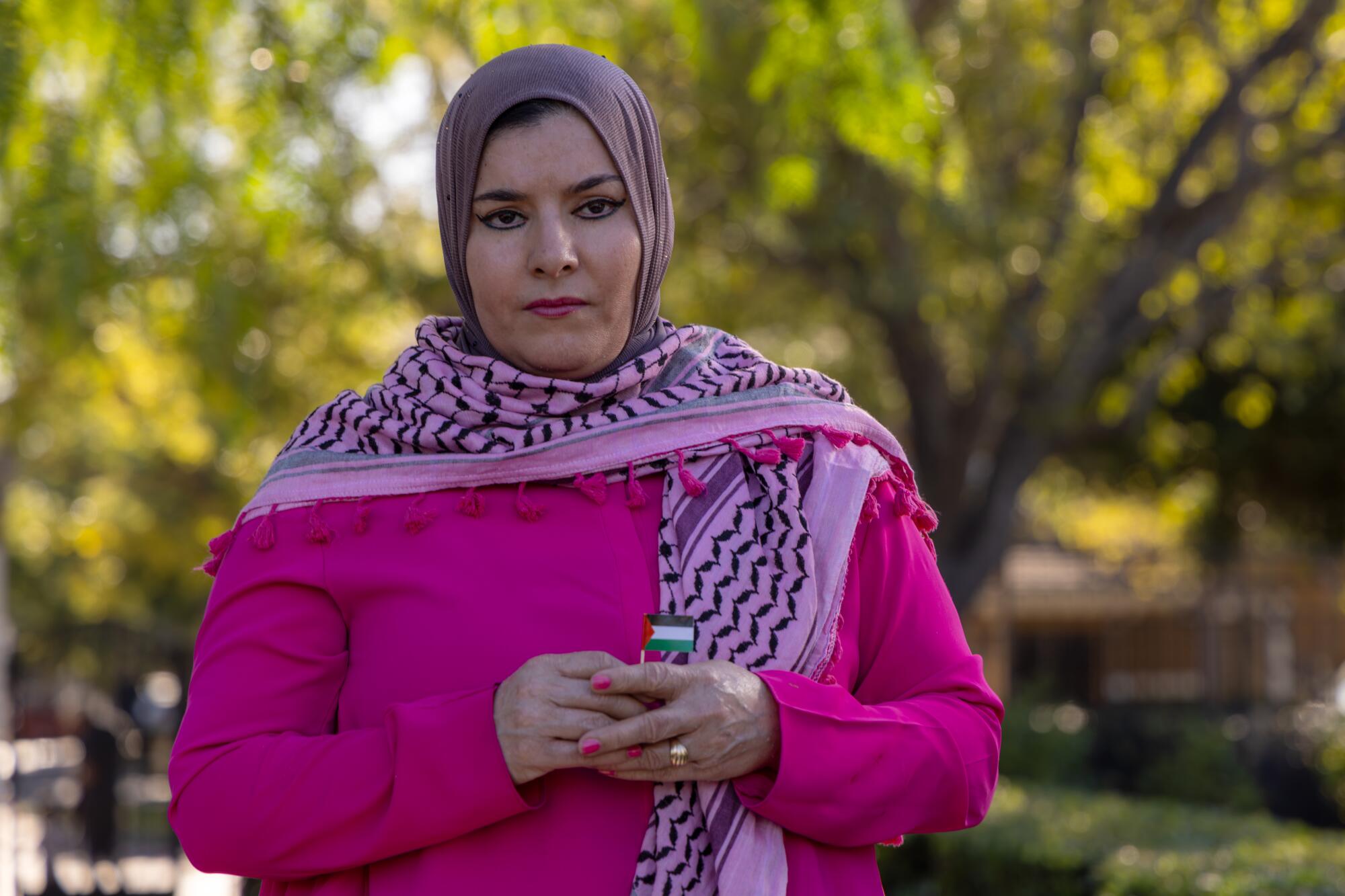 A woman is wearing a headscarf.