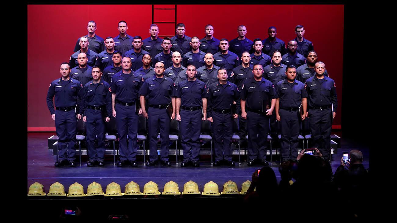 The Verdugo Fire Academy Class XXI stands after graduation ceremony at Glendale Community College in Glendale on Saturday, Jan. 5, 2019.