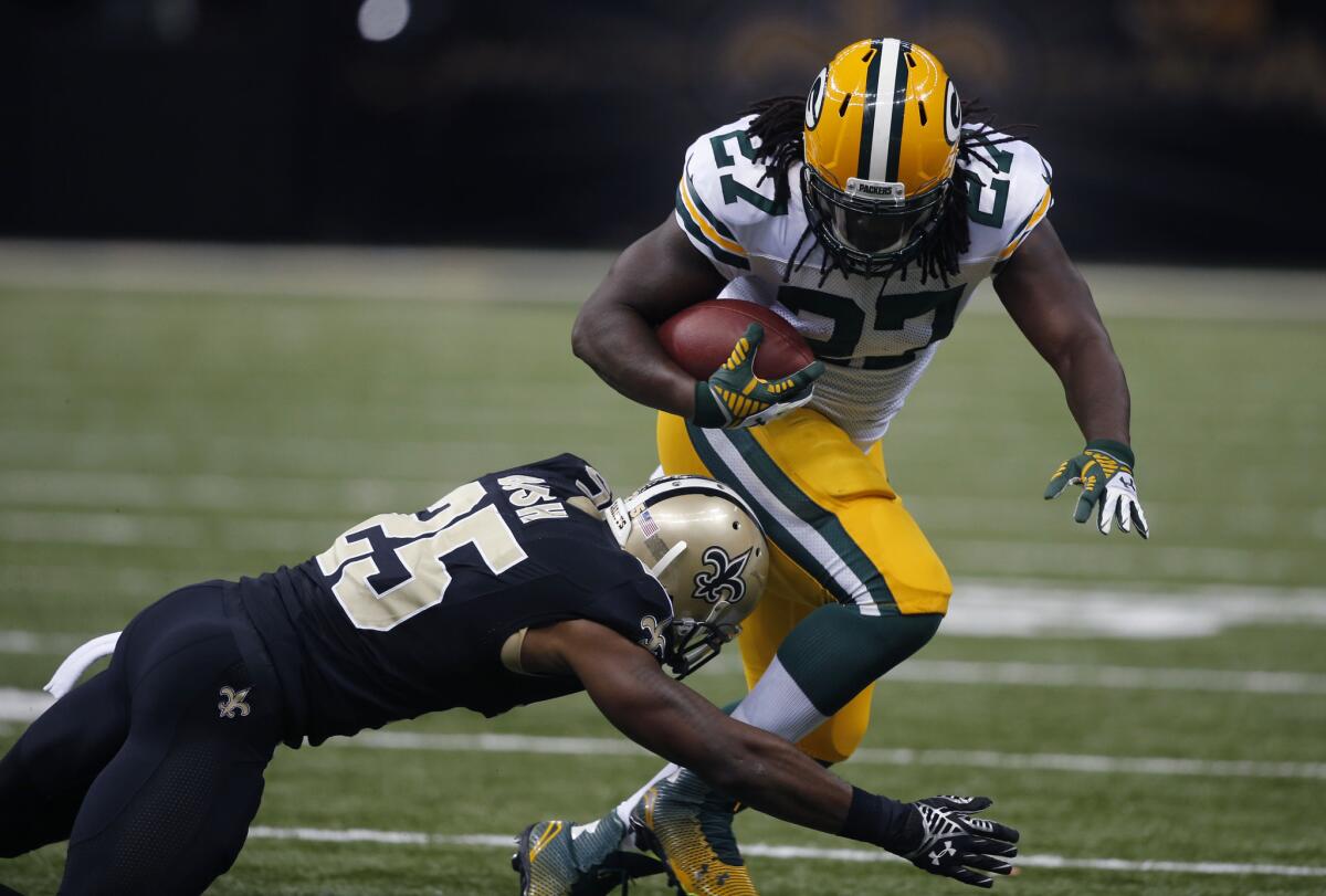 Green Bay Packers running back Eddie Lacy rushes against the New Orleans Saints' Rafael Bush on Oct. 26.